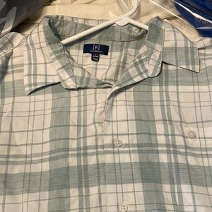 Light green and grey checkered button down shirt.           George.  L.